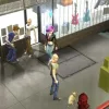 A picture of a street scene with four people talking, walking and walking their dog respectively.
